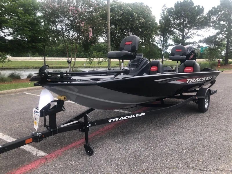 Slide: The Image of 2025 Tracker Pro Team 190 boat on trailer in parking lot. - 13