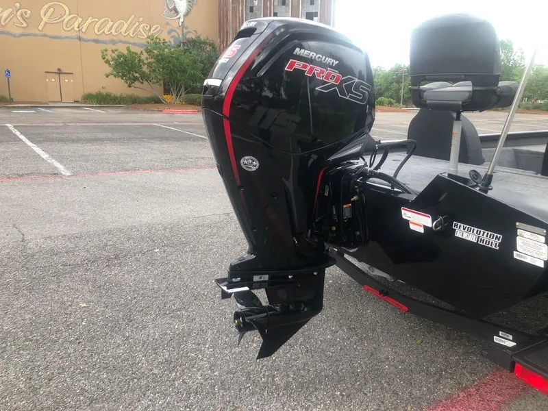Slide: The Image of 2025 Tracker Pro Team 190 boat with Mercury Pro XS engine in a parking lot. - 3