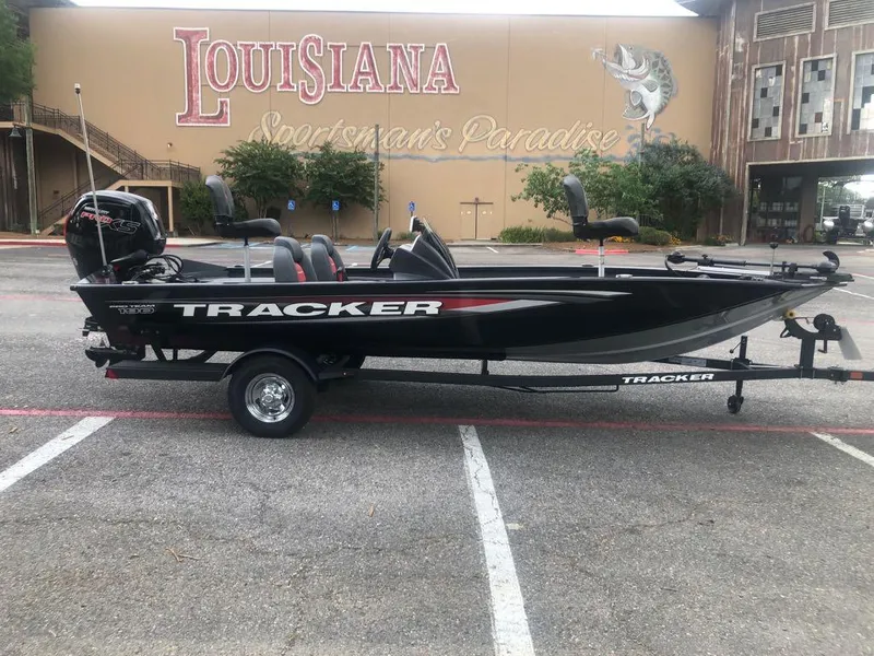 Slide: The Image of 2025 Tracker Pro Team 190 boat on trailer, parked in front of Louisiana Sportsman's Paradise. - 5