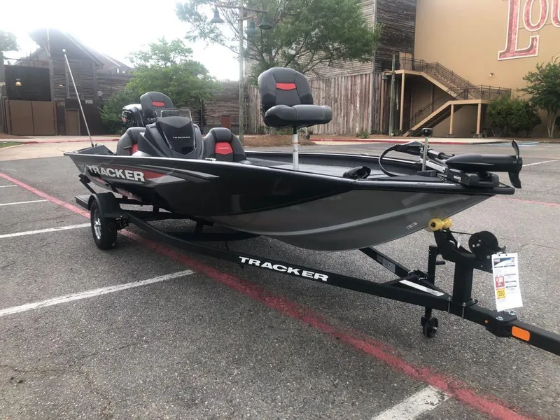 Slide: The Image of 2025 Tracker Pro Team 190 boat on trailer in parking lot. - 6
