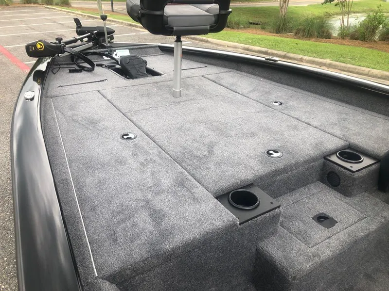 Slide: The Image of 2025 Tracker Pro Team 190 boat deck with seating and storage compartments. - 9