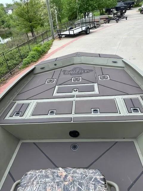 Slide: The Image of 2025 Tracker Grizzly 2072 CC boat with spacious deck and storage compartments. - 5