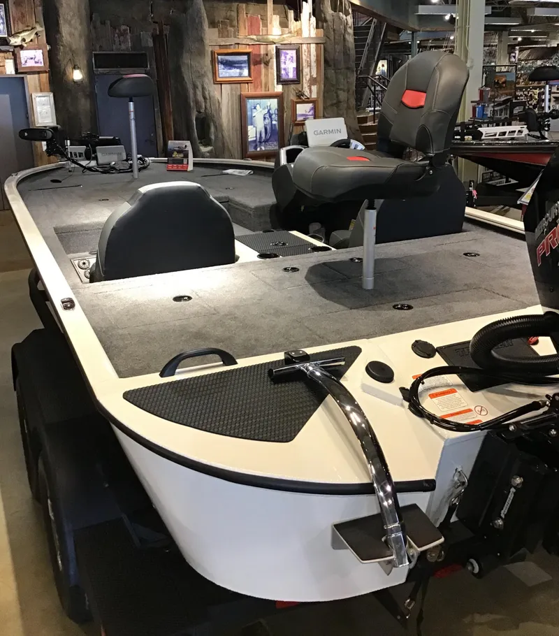 Slide: The Image of 2025 Tracker Savage 215 boat interior with seating and control panel. - 3