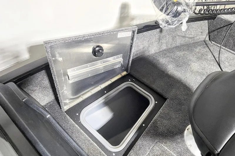 Slide: The Image of 2025 Tracker Pro Guide V-175 Combo boat storage compartment with open hatch. - 4
