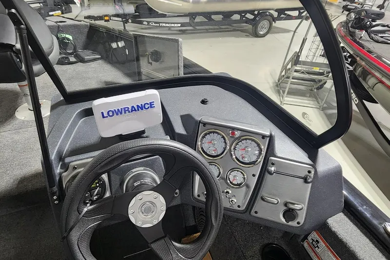 Slide: The Image of 2025 Tracker Pro Guide V-175 Combo boat dashboard with Lowrance display and gauges. - 7