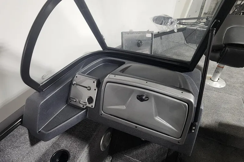 Slide: The Image of 2025 Tracker Pro Guide V-175 Combo boat interior with storage compartment and seating. - 8