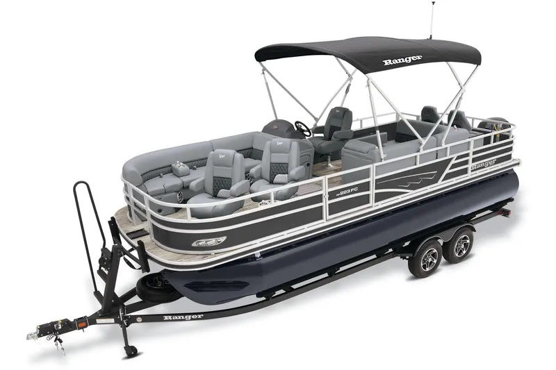 Slide: The Image of 2025 Ranger Reata 223FC boat interior with beige seating and modern helm. - 3