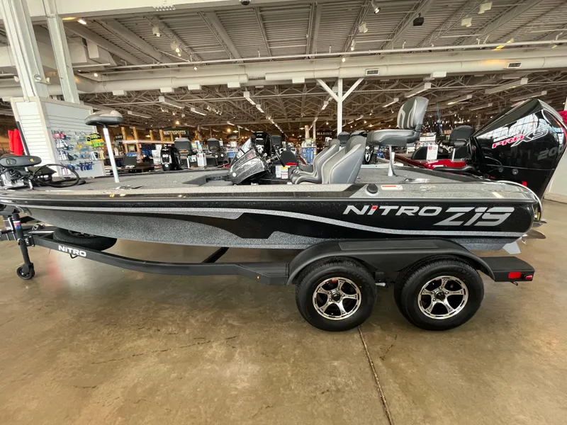 Slide: The Image of 2025 Nitro Z19 Pro fishing boat displayed indoors on a trailer. - 0
