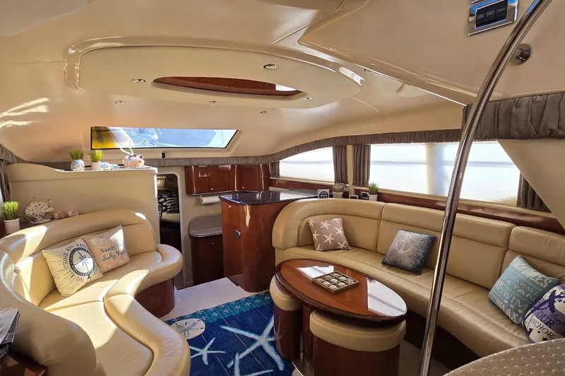 Slide: The Image of Luxurious interior of 2003 Sea Ray 390 Motor Yacht with elegant seating and decor. - 2