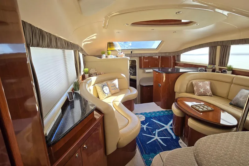 Slide: The Image of Luxurious interior of 2003 Sea Ray 390 Motor Yacht with elegant seating and decor. - 3