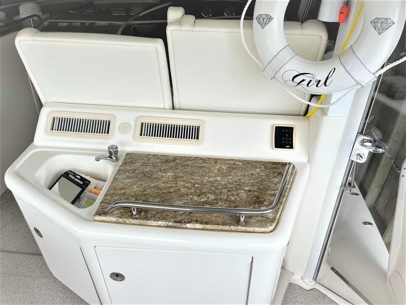 Slide: The Image of AFT DECK WETBARD WITH CUSTOM GRANITE INSERT, FRIDGE, & AC/HEAT - 31