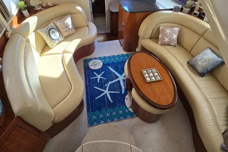 Slide: The Image of Luxurious 2003 Sea Ray 390 Motor Yacht interior with elegant seating and nautical decor. - 4