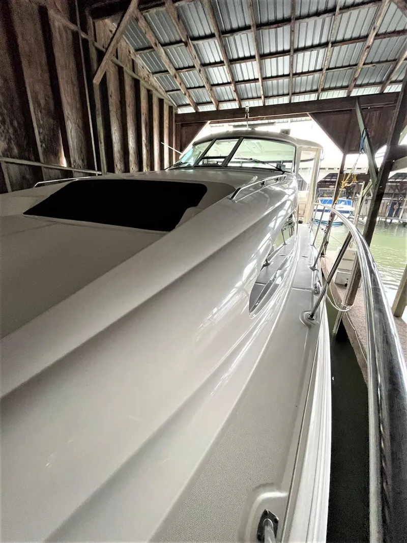 Slide: The Image of 2003 Sea Ray 390 Motor Yacht docked in a covered marina. - 45