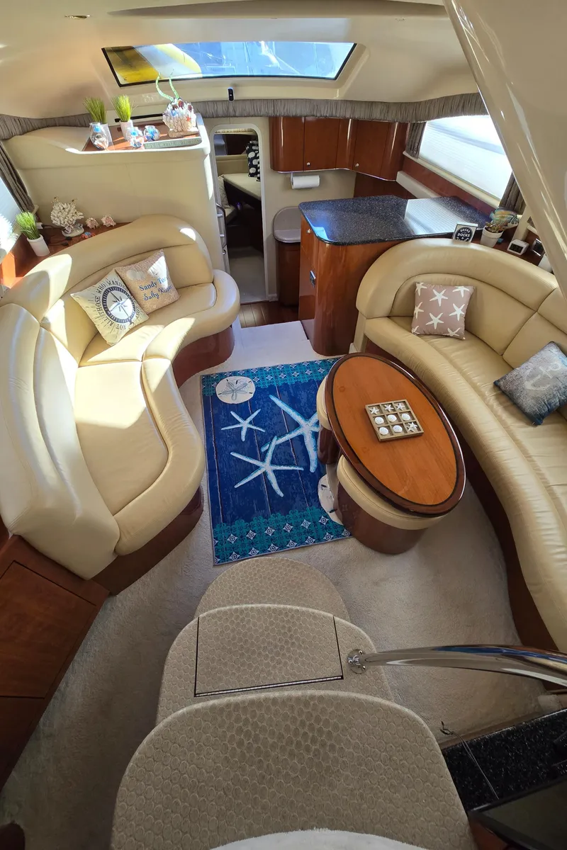 Slide: The Image of Luxurious interior of 2003 Sea Ray 390 Motor Yacht with elegant seating and decor. - 5