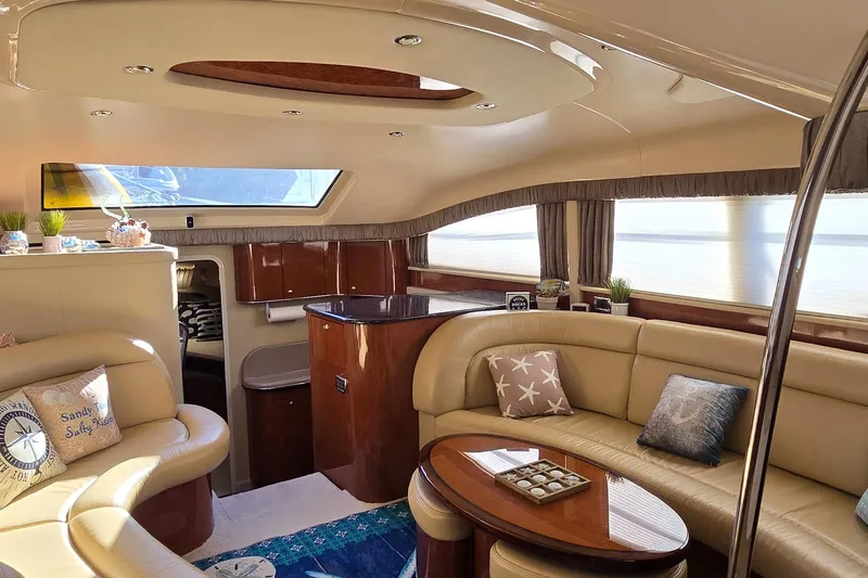 Slide: The Image of Luxurious interior of 2003 Sea Ray 390 Motor Yacht with elegant seating and decor. - 6