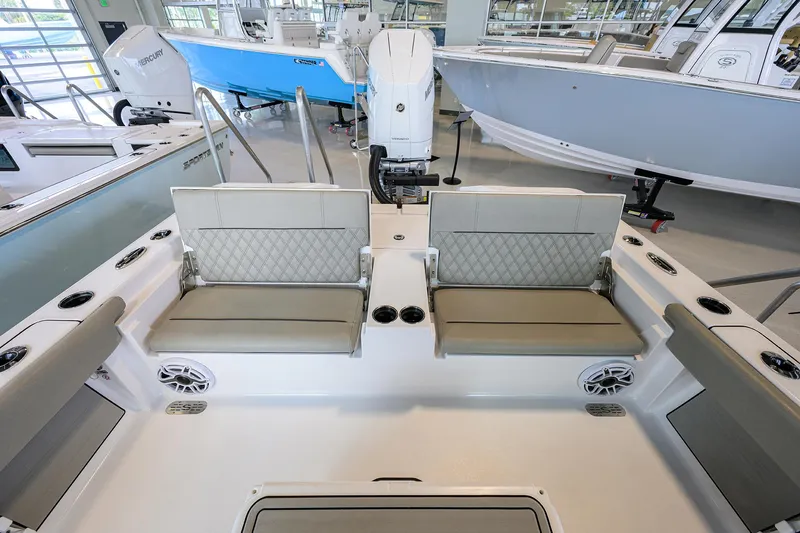 Slide: The Image of 2025 Sportsman Masters 267 Bay Boat interior with cushioned seating and modern design. - 14