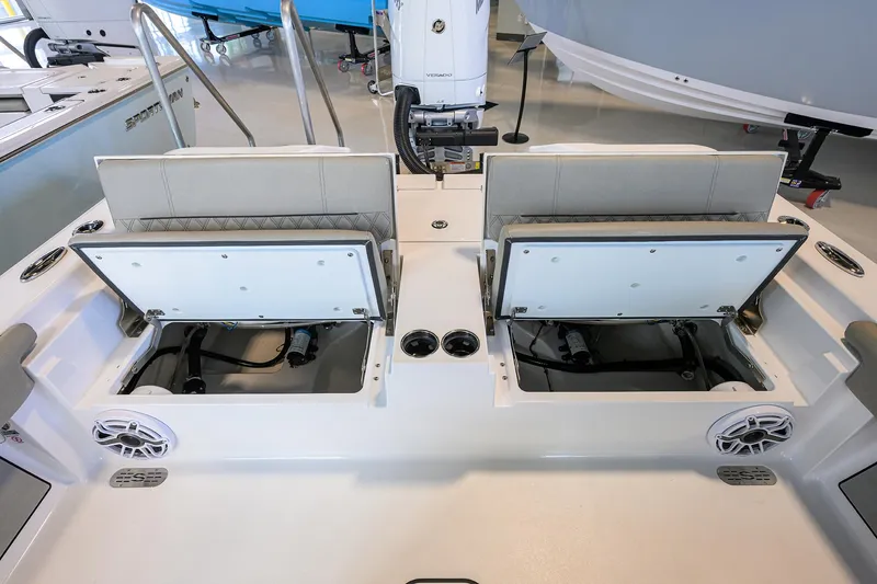 Slide: The Image of 2025 Sportsman Masters 267 Bay Boat with open storage compartments and seating. - 18