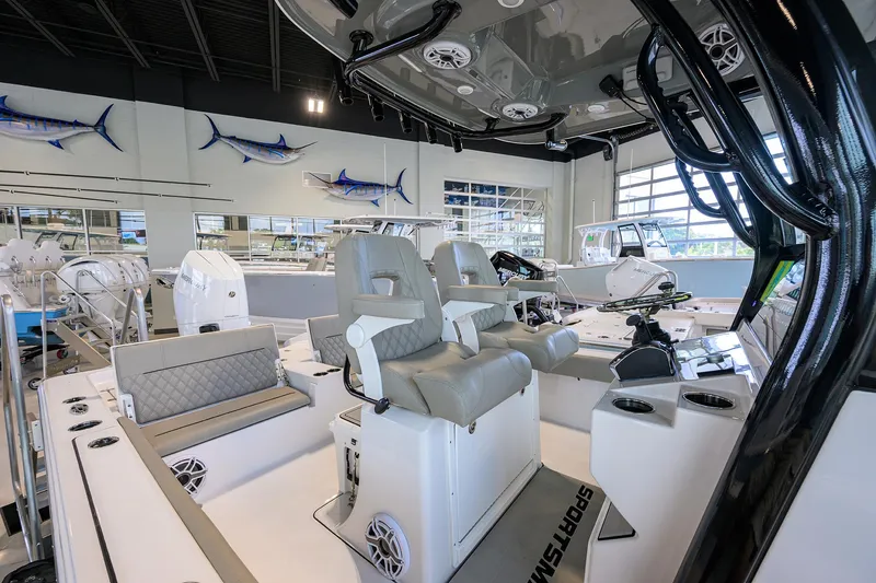 Slide: The Image of 2025 Sportsman Masters 267 Bay Boat interior with modern seating and fishing equipment. - 25