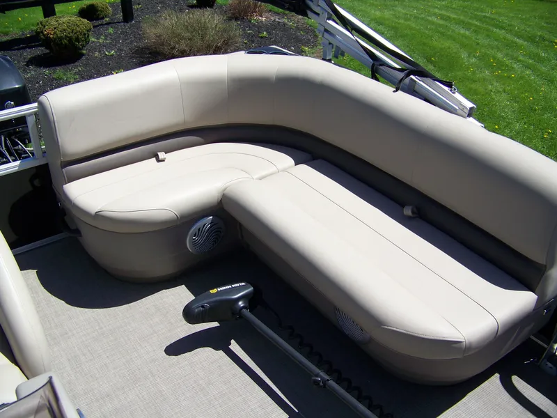 Slide: The Image of 2021 Sun Tracker Bass Buggy 16 XL pontoon boat with beige seating and trolling motor. - 6