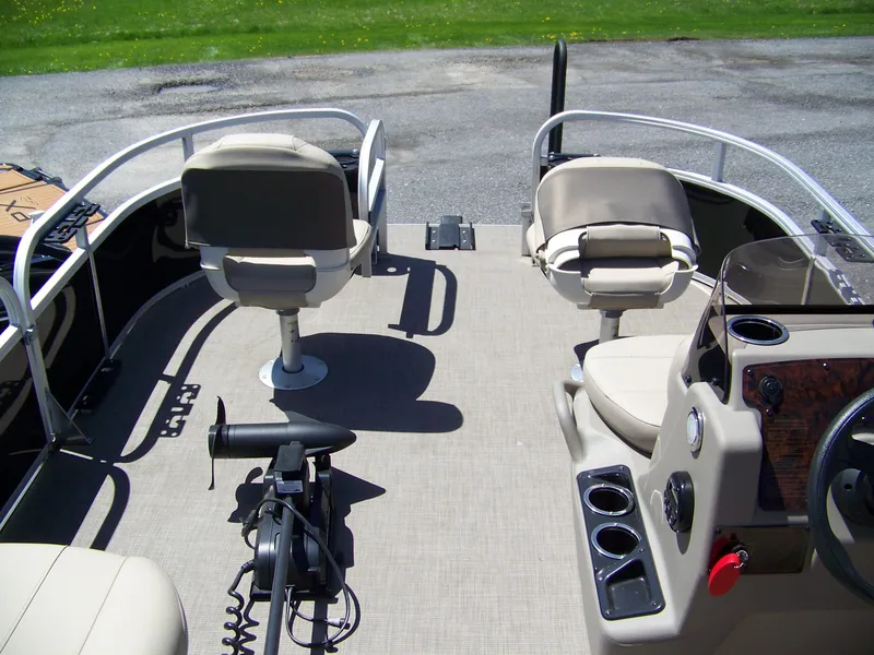 Slide: The Image of 2021 Sun Tracker Bass Buggy 16 XL interior with seating and control panel. - 8
