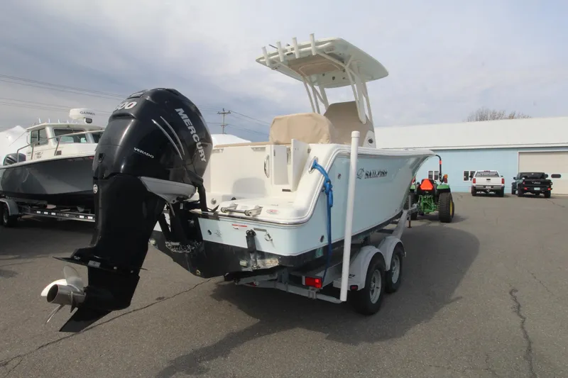 Slide: The Image of 2017 Sailfish 236 CC boat with Mercury outboard motor on trailer. - 2
