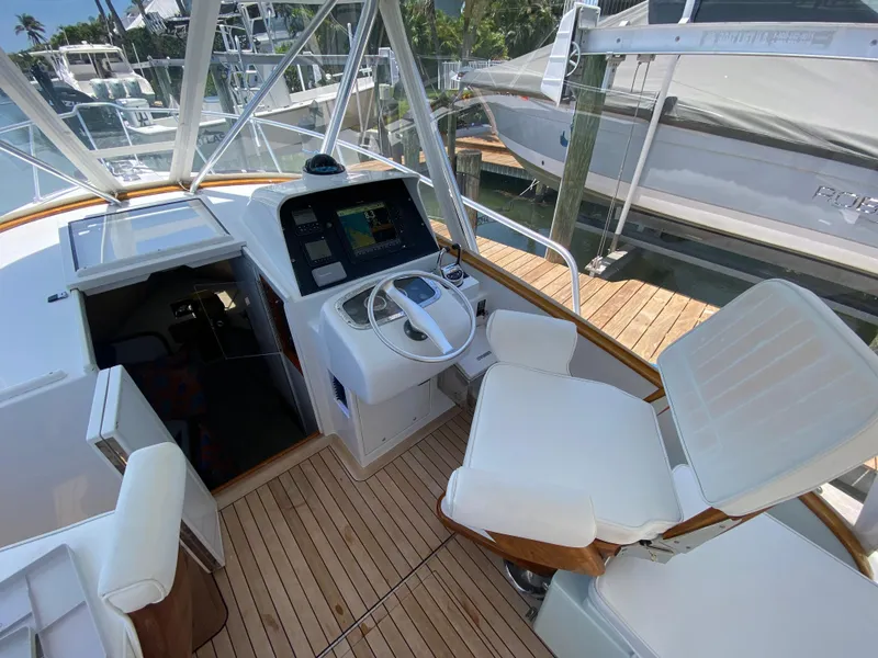 Slide: The Image of Helm of 1995 L&H 33 boat with modern controls and seating. - 16
