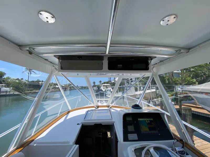 Slide: The Image of Interior view of a 1995 L&H 33 boat cockpit with navigation equipment. - 18