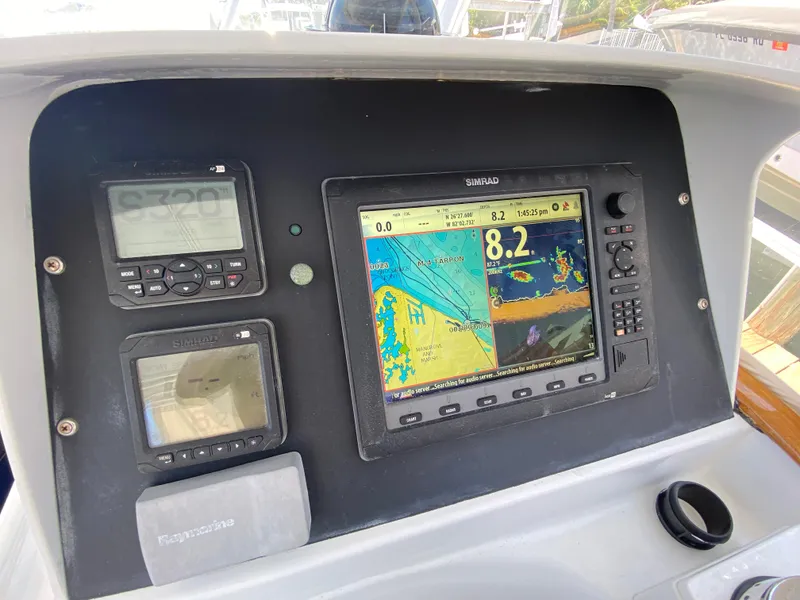 Slide: The Image of Control panel of a 1995 L&H 33 boat with navigation and radar displays. - 19