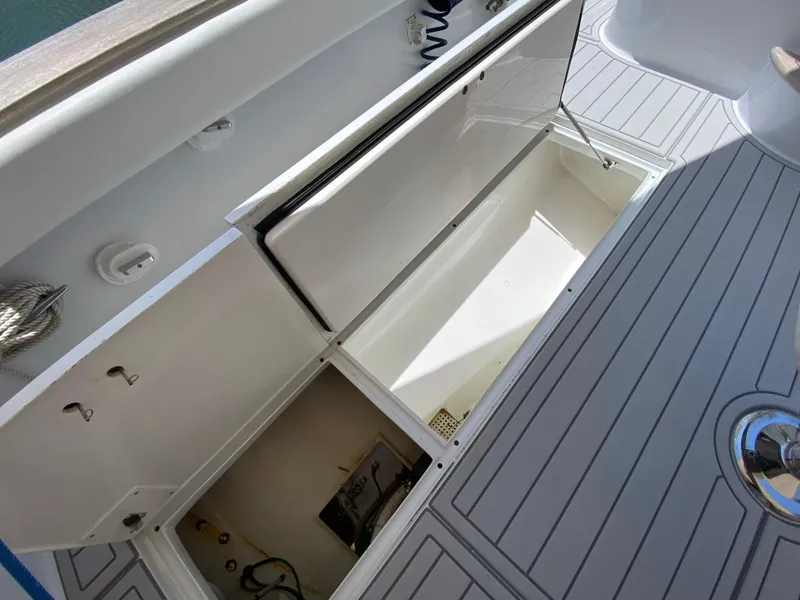 Slide: The Image of Open storage compartments on a 1995 L&H 33 boat deck. - 39