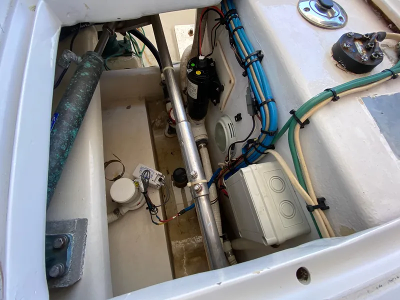 Slide: The Image of Engine compartment of a 1995 L&H 33 boat, showcasing wiring and mechanical components. - 41
