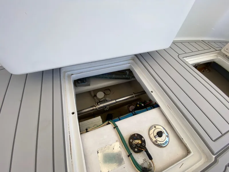 Slide: The Image of Open hatch on 1995 L&H 33 boat deck, revealing mechanical components. - 43