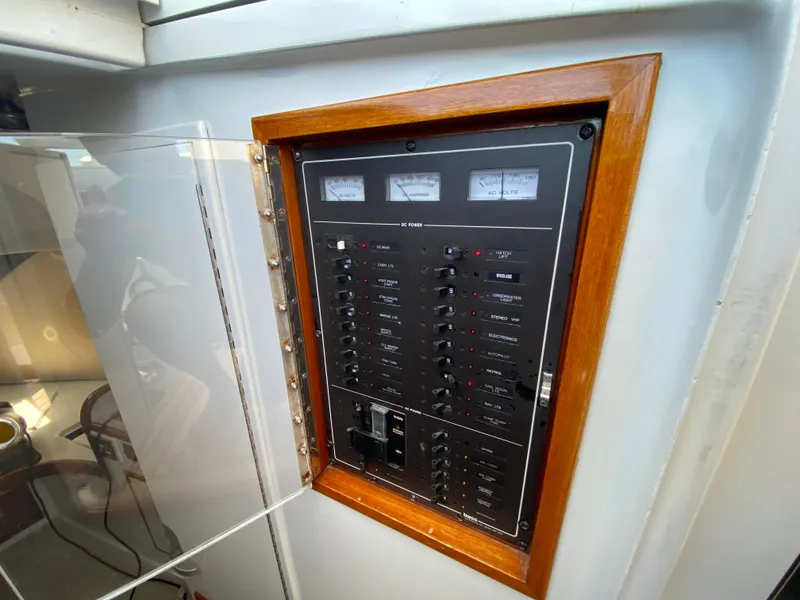 Slide: The Image of Electrical panel on a 1995 L&H 33 boat, featuring switches and gauges. - 44