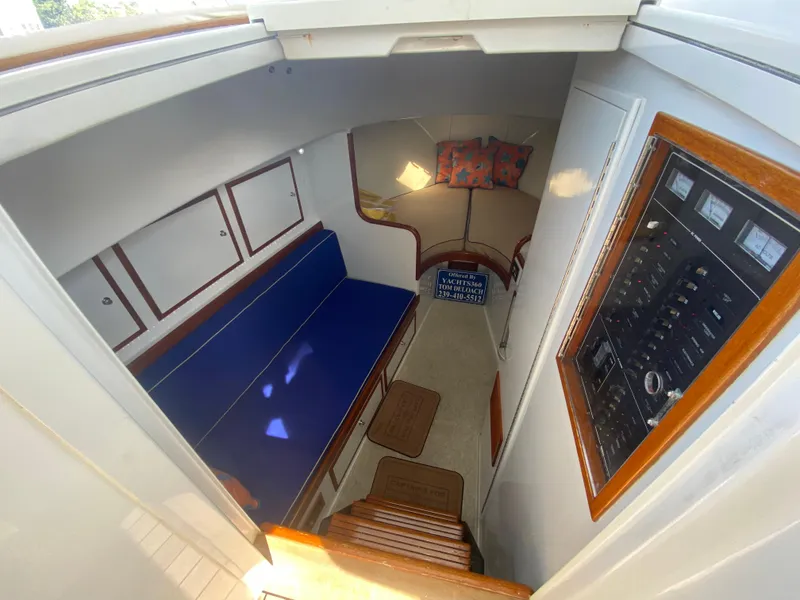 Slide: The Image of Interior of a 1995 L&H 33 boat, featuring seating, control panel, and storage. - 45