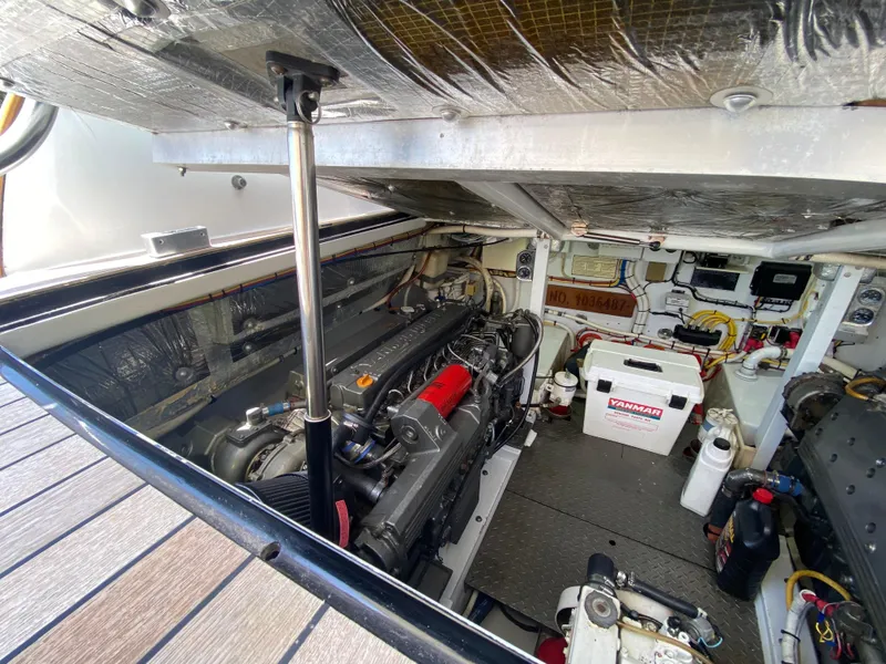 Slide: The Image of Engine room of a 1995 L&H 33 boat, showcasing mechanical components and equipment. - 66