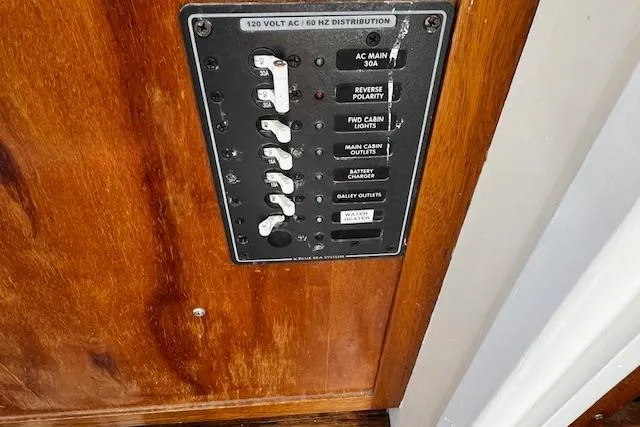 Slide: The Image of Electrical panel on 1978 Bruno & Stillman Custom Cruiser/Sportfisherman boat, featuring various switches. - 13
