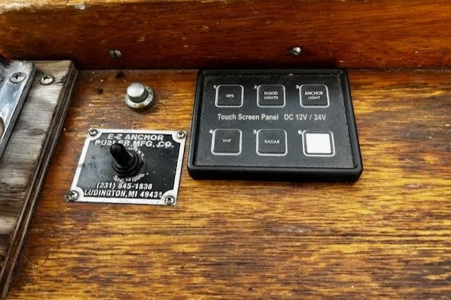 Slide: The Image of Control panel of a 1978 Bruno & Stillman Custom Cruiser/Sportfisherman with touch screen and switches. - 15