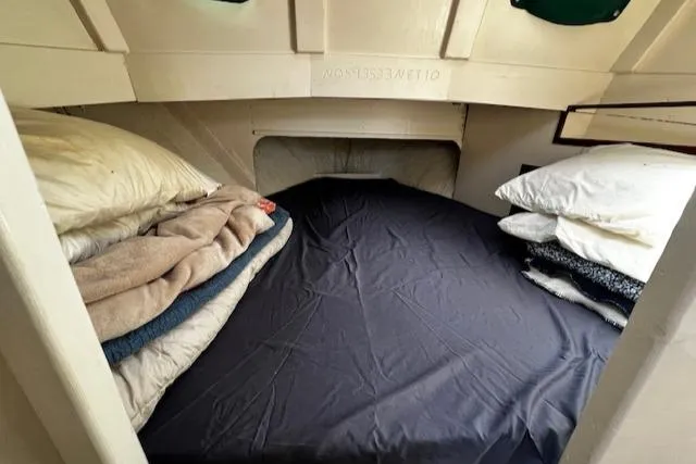 Slide: The Image of 1978 Bruno & Stillman Custom Cruiser cabin with cozy bedding and pillows. - 18