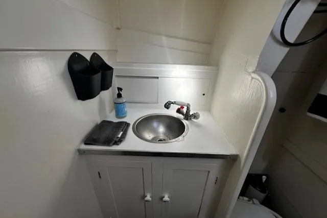 Slide: The Image of 1978 Bruno & Stillman Custom Cruiser bathroom sink with storage cabinet and faucet. - 20