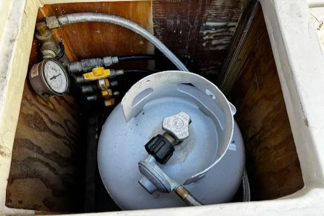 Slide: The Image of Propane tank in a 1978 Bruno & Stillman Custom Cruiser/Sportfisherman boat compartment. - 23
