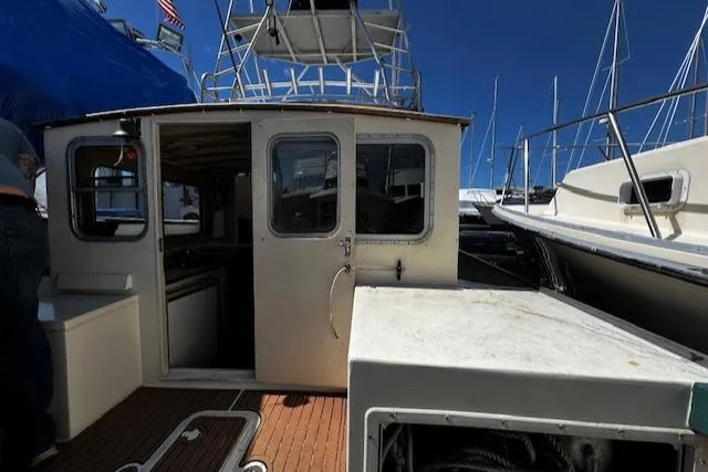 Slide: The Image of 1978 Bruno & Stillman Custom Cruiser/Sportfisherman boat with open cabin and deck view. - 26