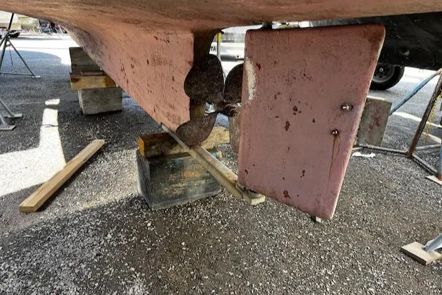 Slide: The Image of 1978 Bruno & Stillman Custom Cruiser/Sportfisherman boat propeller and rudder detail. - 30