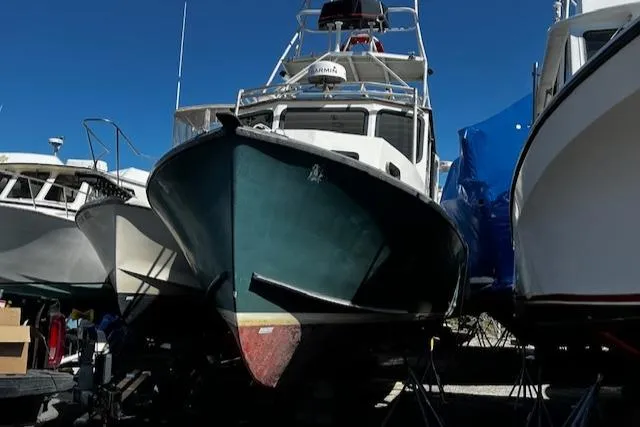 Slide: The Image of 1978 Bruno & Stillman Custom Cruiser/Sportfisherman boat on dry dock, surrounded by other vessels. - 31