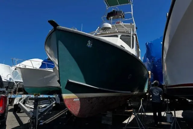 Slide: The Image of 1978 Bruno & Stillman Custom Cruiser/Sportfisherman boat on dry dock under clear blue sky. - 32
