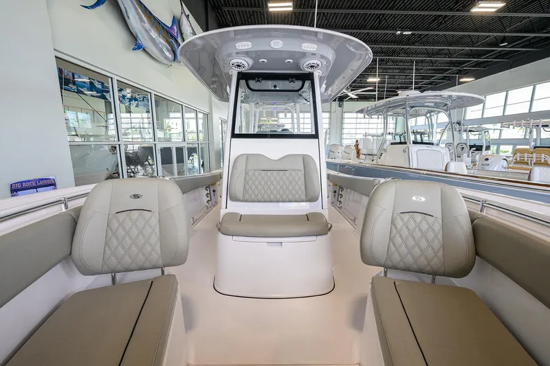 Slide: The Image of 2025 Sportsman Open 282 Center Console boat interior with cushioned seating. - 10