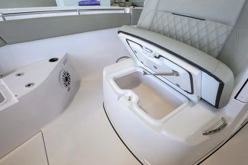 Slide: The Image of 2025 Sportsman Open 282 Center Console boat interior with storage compartment and seating. - 16