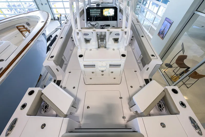 Slide: The Image of 2025 Sportsman Open 282 Center Console boat interior with modern seating and control panel. - 19