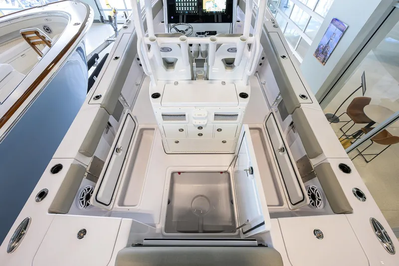 Slide: The Image of 2025 Sportsman Open 282 Center Console boat interior with seating and storage compartments. - 20