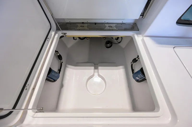 Slide: The Image of 2025 Sportsman Open 282 Center Console storage compartment, featuring clean, spacious design. - 21