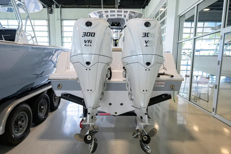 Slide: The Image of 2025 Sportsman Open 282 Center Console with twin 300 V6 engines in showroom. - 3