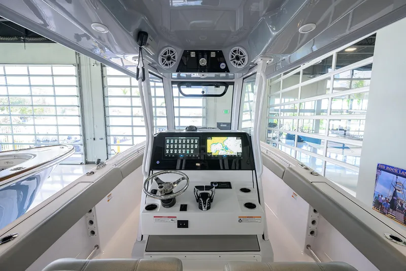 Slide: The Image of 2025 Sportsman Open 282 Center Console boat interior with modern navigation system. - 6